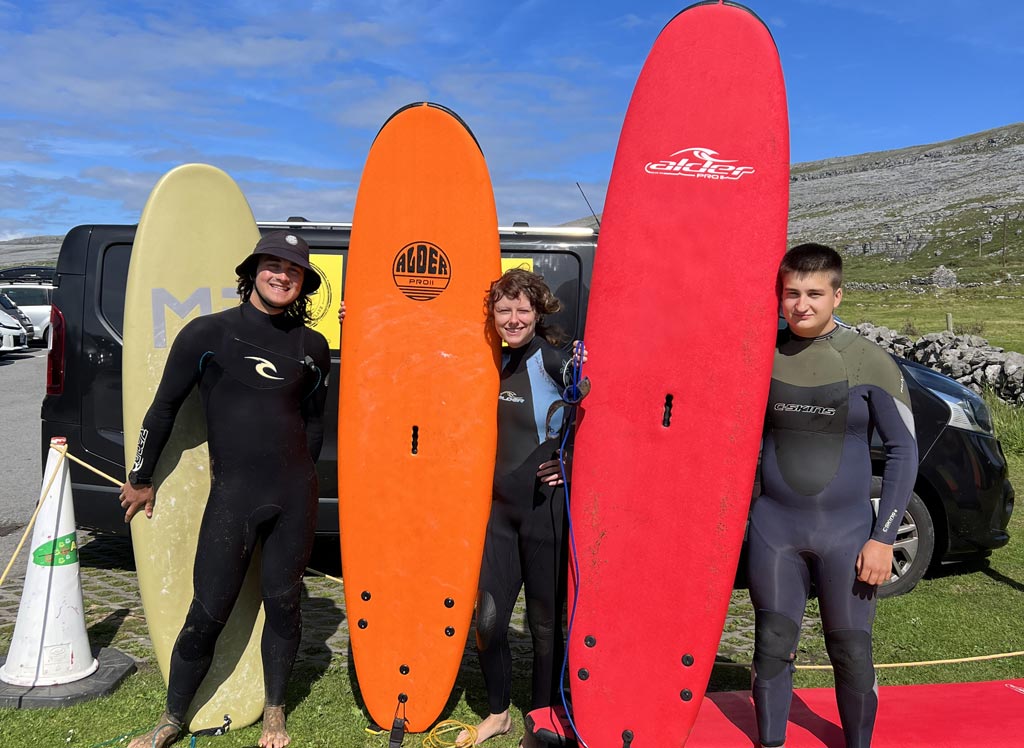 boys with surf boards -surf in galway